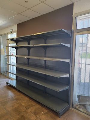 a empty shelf in the middle of an empty room