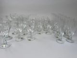 a lot of empty wine glasses sitting on a table