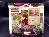 a close up of a box of pokemon cards on a couch