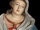 a statue of a woman holding a piece of paper in her hands
