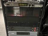 a black cabinet with a radio on top of it
