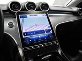 the dashboard of a car with a tablet on the dashboard