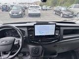 a dashboard of a car with a lot of cars in the background