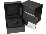 a close up of a box with a watch inside of it
