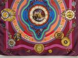 purple silk scarf with gold medallions and a square orange box