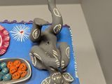 a cake with an elephant on it on a table