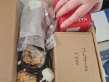 a person that is opening a box of food