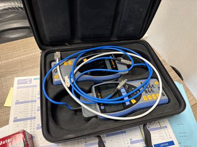 a black case with a bunch of cables in it