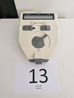 a clock that is on a table with a number 13 on it