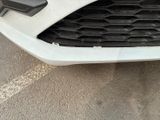 a close up of a car ' s front bumper and grille