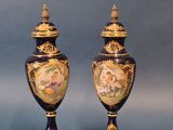 pair of antique vases with hand painted scenes on them