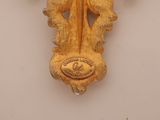 a wooden cross with a cross on it on a wall