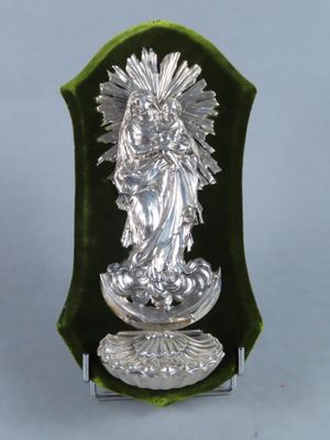 an image of a statue of a woman holding a baby in her arms