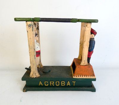 a wooden toy of a man and a woman on a scale