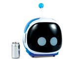 un petit robot jouet bleu et blanc posé à côté d'une canette de soda