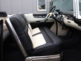 a black and white interior of a car with a steering wheel