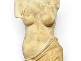 a sculpture of a woman ' s torso is shown against a white background