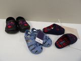 several pairs of shoes that are sitting on a table