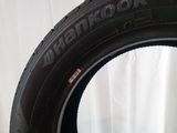 a close up of a tire on a white surface with a white background