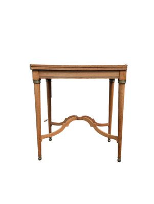 an image of a small table with a wooden top and legs