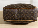 a close up of a louis vuittou toilet bag on a table
