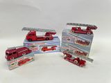three toy firetrucks that are sitting on a table