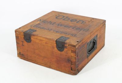 a small wooden box with a sign on it