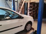 a white car that is parked in a garage