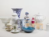 many different types of vases and bowls on the table
