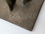 a close up of a bronze sculpture of a bird