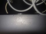 a close up of a laptop with a bunch of wires on top of it