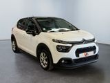 the white citrole is parked in a large room