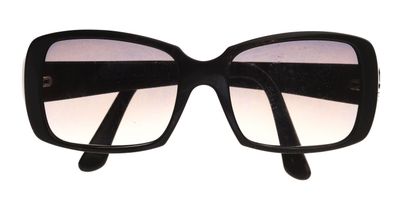 sunglasses on a white background with a black frame and a pink lens