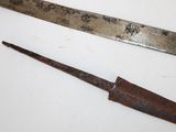 two old knives that are laying on a table