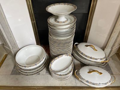 a lot of plates and bowls sitting on a table