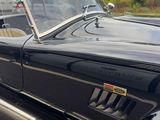 an image of a classic car parked in a parking lot