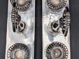 pair of antique silver plated candlestick holders with flower design