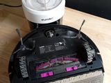a robot that is sitting on a table next to a blender