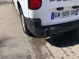 a white pick up truck parked on the side of the road