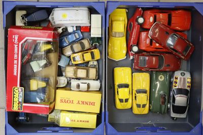two blue boxes with toy cars in them on a table