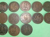 a close up of a bunch of coins on a green surface