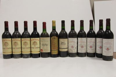 several bottles of wine are lined up in a row on a table