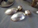 a lot of silver objects that are on a table