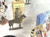 many figurines on display in a display case