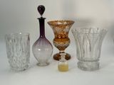 a lot of glass vases sitting on a table