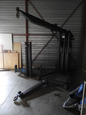 an image of a garage with a crane in the middle of it