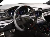 the interior of a sports car with a steering wheel and dashboard
