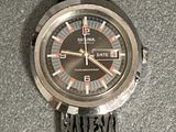 a close up of a wrist watch on a table
