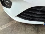 a close up of the front of a white car