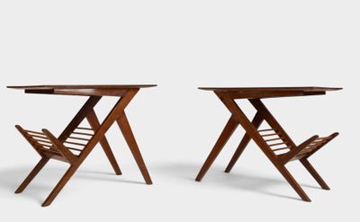 pair of folding chairs with magazine racks on each side